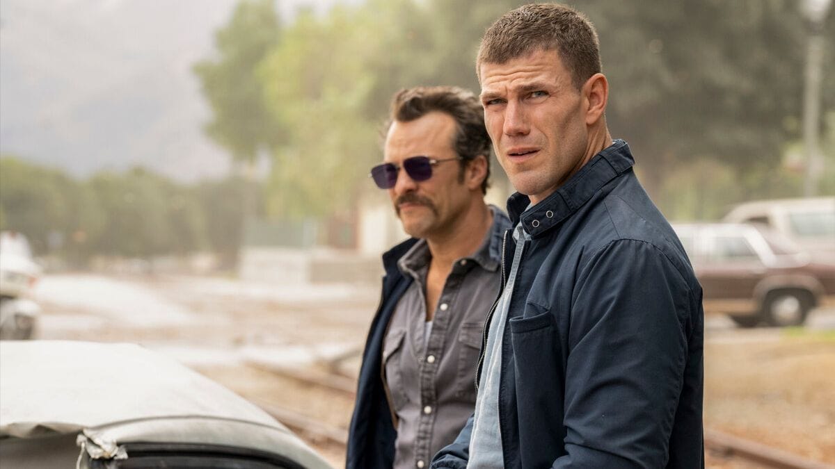 Actor Kyle Schmid as Mike Franks and actor Austin Stowell as Leroy Jethro Gibbs in NCIS Origins season 2 episode 5. (Photo Credit: Courtesy of CBS.)