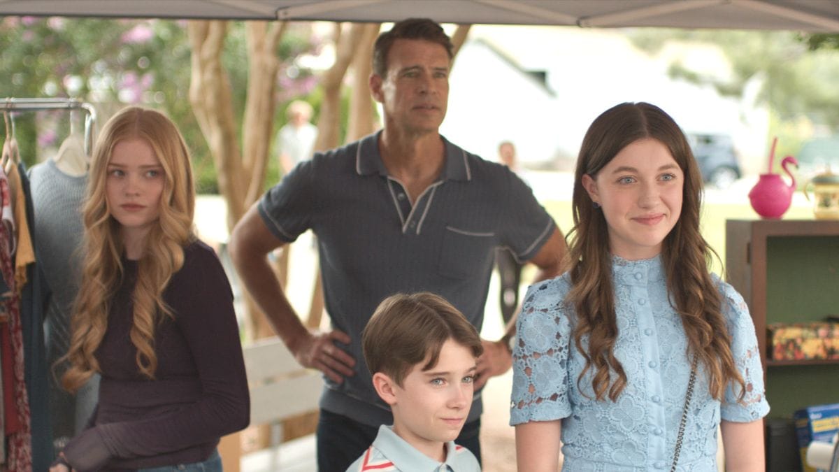 The Jeffries family stands together at the community rummage sale in It's Not Like That season 1, episode 3. (Photo Credit: Steve Dietl/Courtesy of Amazon MGM Studios.)