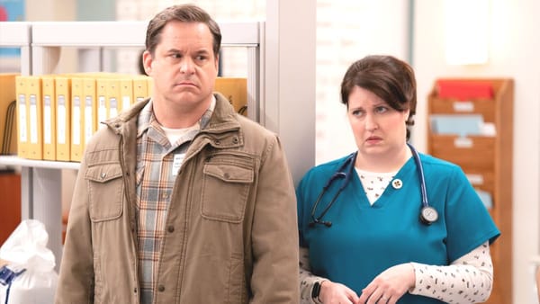 Actor Kyle Bornheimer as Tim and actor Allison Tolman as Alex in St Denis Medical season 2 episode 3. (Photo Credit: Courtesy of NBC.)