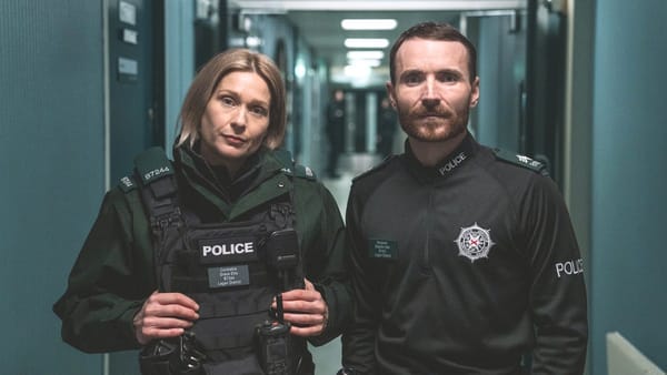 Actor Siân Brooke as Grace Ellis and actor Martin McCann as Stevie Neil in Blue Lights season 3. (Photo Credit: Peter Marley/Courtesy of BritBox.)